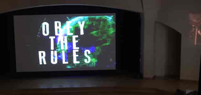 Chrysalis Theatre Crypt stage: distracting slide content at corporate event and conference.