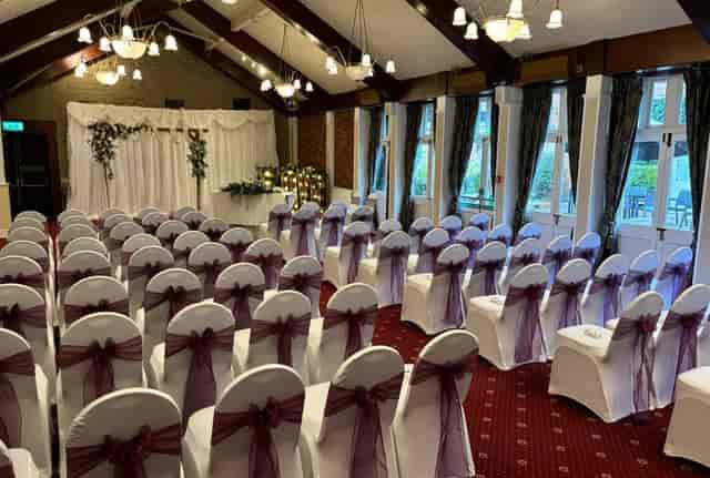 Wedding ceremony in Marquee Suite, The Cock Hotel, featuring theater-style seating.