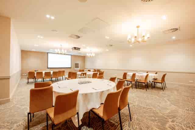 Banquet-style breakout room at Covent Garden, Strand Palace for corporate workshops and events.