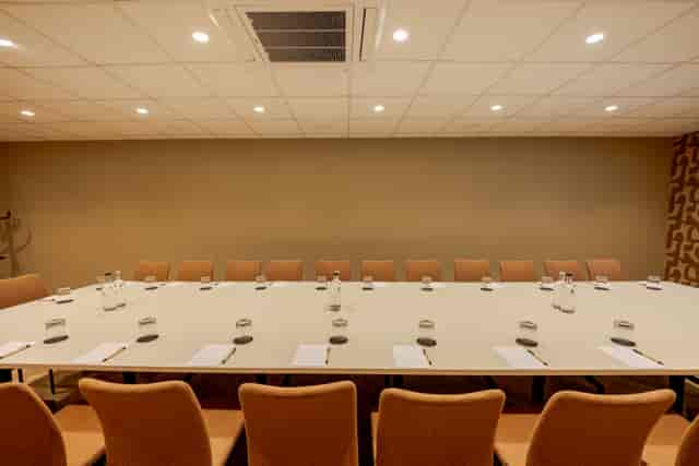 Minimalist boardroom setup at Strand Palace West End for corporate strategy meetings.