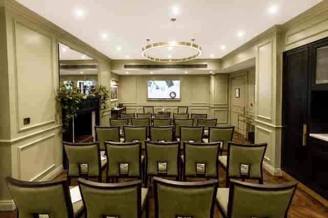 The Curio Room boardroom at 11 Cadogan Gardens: upscale theatre-style executive meeting venue.