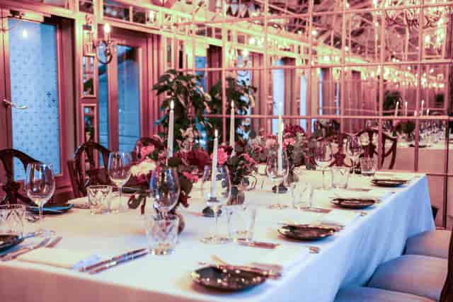 Mirror Room at 11 Cadogan Gardens with candlelit dining for corporate events and luxury dinners.