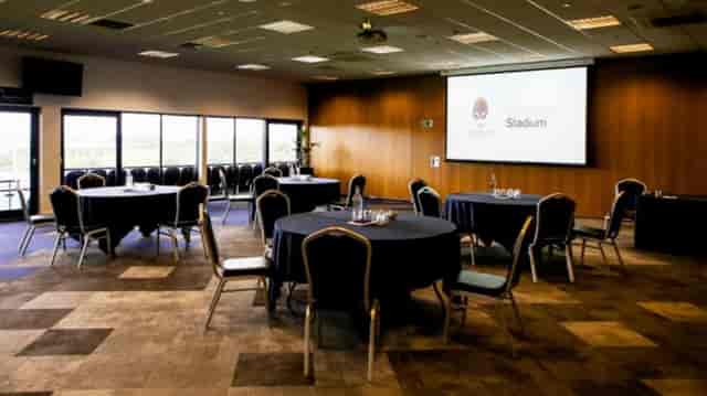 Sterling Suite meeting room with stadium view, banquet setup for corporate events or workshops.