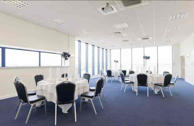 Sixways Stadium banquet hall with floor-to-ceiling windows for corporate events and luncheons.
