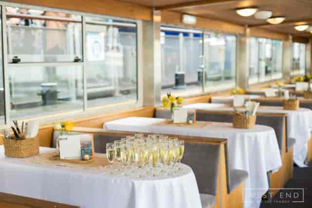 WEOTT I river cruiser event space with floral decor for intimate reception and networking cruises.