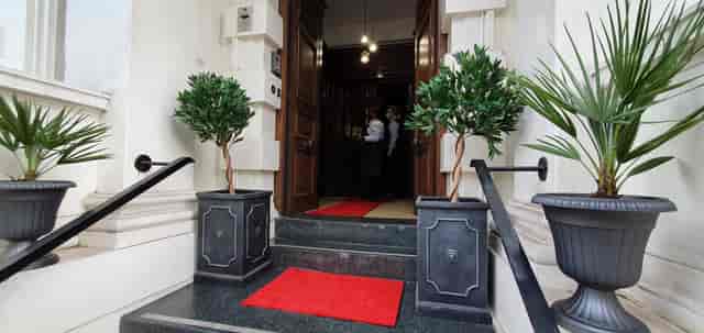 Luxury wedding venue entrance with red carpet, Lumiere London Embassy for premium event photography.