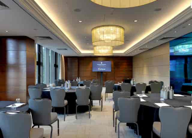 Executive boardroom at InterContinental London Park Lane with wood paneling for corporate meetings.