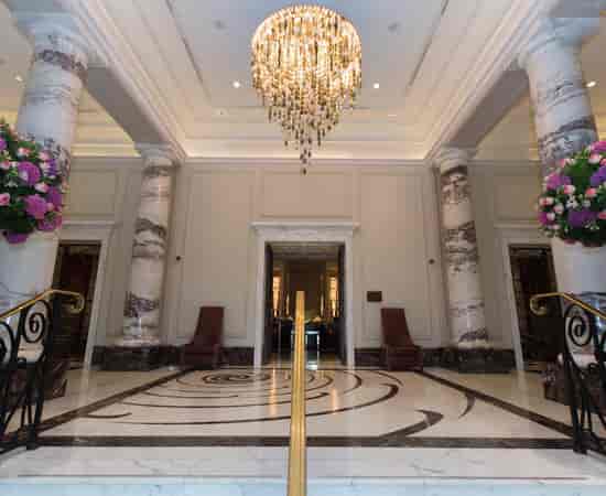 Luxury Langham London pre-function area for upscale corporate events and elegant wedding receptions.