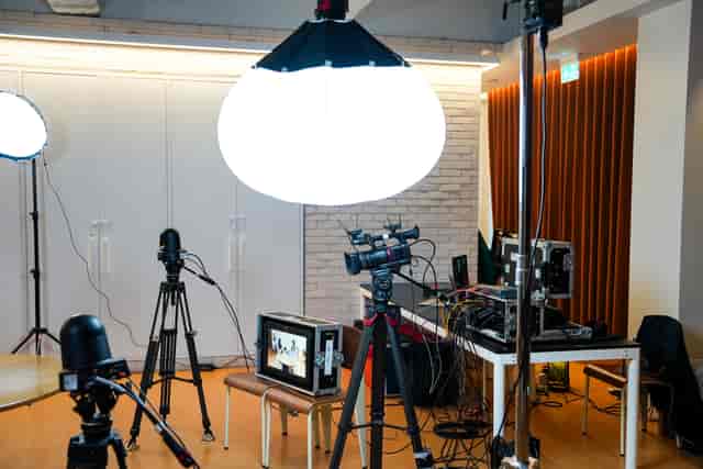 Studio 9 professional hybrid event studio with broadcast lighting and camera gear.