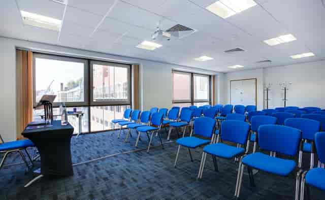 Theater-style corporate meeting room in CCT Venues Moorgate with speaker lectern.