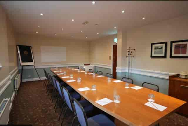 Boardroom setup for 12 at The Hickstead Hotel, ideal for corporate meetings and team workshops.