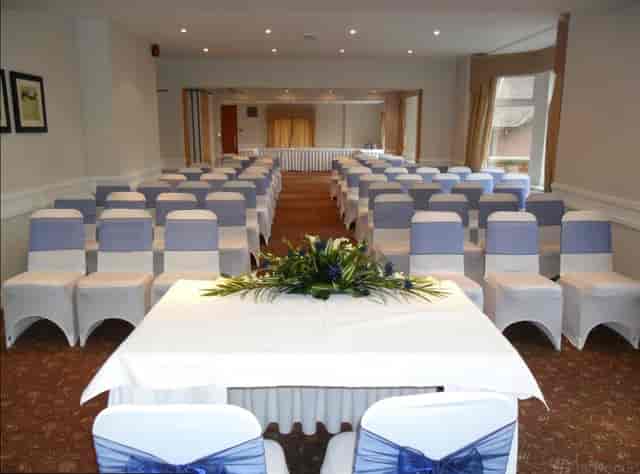 Surrey Room wedding ceremony with floral centerpiece for elegant venue events.