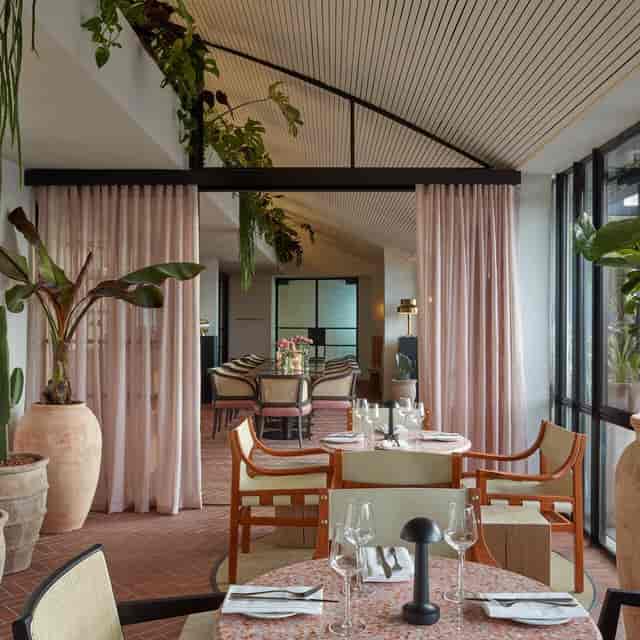 High-end Kaso Rooftop breakout space with privacy drapes for VIP meetings and corporate events.