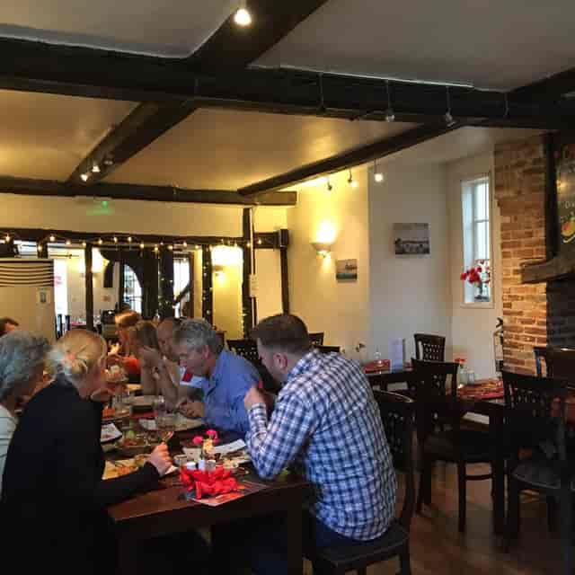Rustic private dining room with exposed brick, perfect for corporate events and team building.
