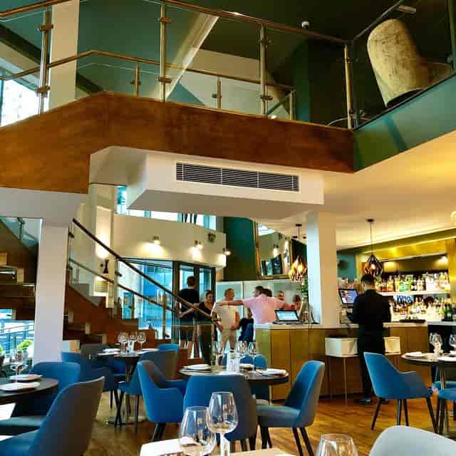 Private dining room with bar for corporate networking reception and formal events.