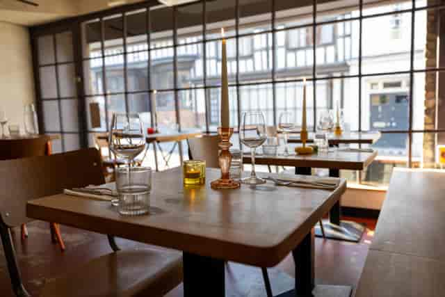 Private dining room at Skew with industrial-chic decor for networking events and rehearsal dinners.