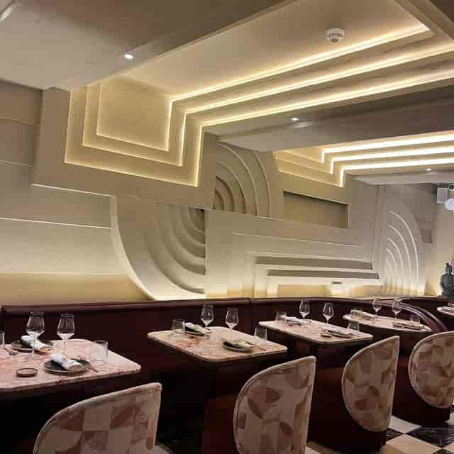 Art Deco dining room at Enkai with backlit walls for VIP events and networking dinners.
