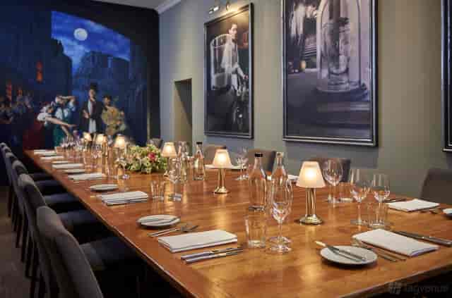 Private dining room at The Hare with bespoke art, ideal for executive dinners and boardroom meetings.