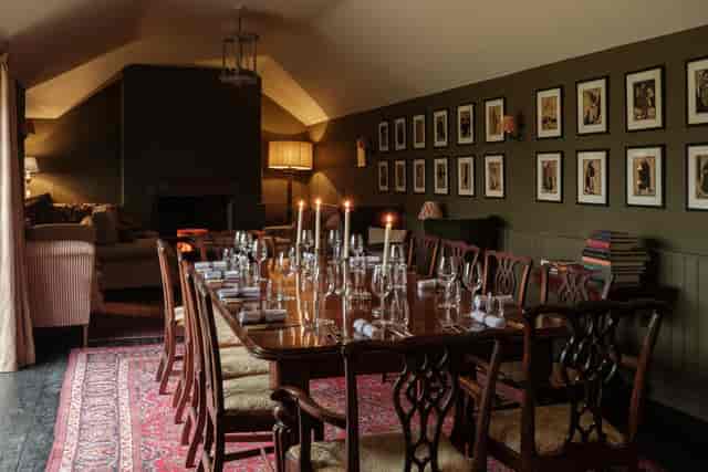 Candlelit private dining room at The Hare, perfect for executive retreats and board meetings.