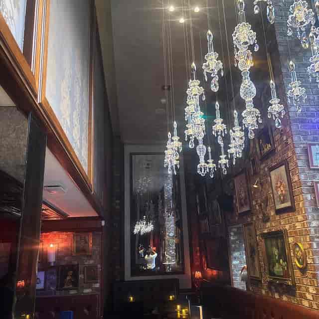 Dovetail Bar private room with crystal chandeliers for upscale cocktail reception and events.
