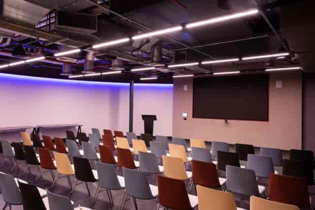 Modern theater-style event hall at Storey Club Paddington for professional presentations and training.