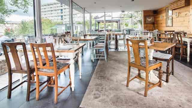 The Balcony at The Old Frizzle: rustic light-filled space for networking events and private dining.