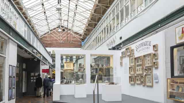 Boutique exhibition in Manchester light-filled industrial venue with glass ceiling for pop-up art.