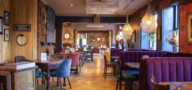 Whole Hall event space at Allenburys with warm decor, ideal for conferences and networking.