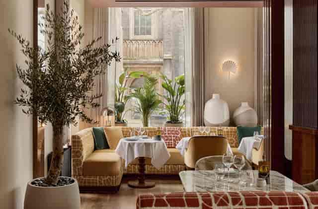 Luxury VIP dinner breakout space at La Môme London with plush banquette seating.