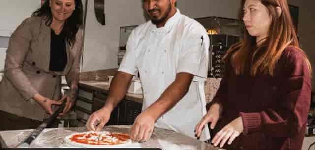 Team building at Pizza Pārā: interactive culinary venue hire for corporate events.
