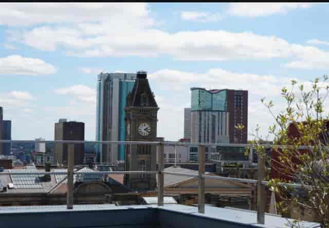 Rooftop event space at 99Brum Studios with city skyline for networking and cocktail parties.