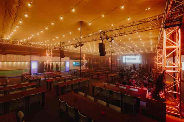 Industrial-chic Christmas party venue in Freight Brixton with bistro lighting for corporate events.