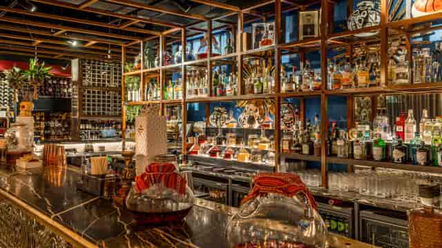 Bar Coyo venue with curated shelving for premium post-conference networking and VIP receptions.