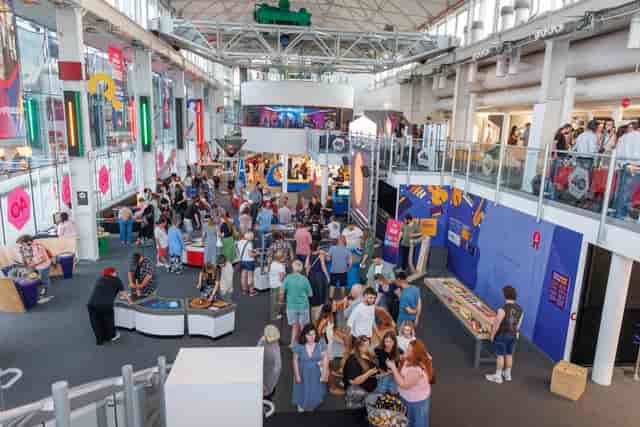 Techniquest multi-level venue with interactive stations for corporate events and networking.