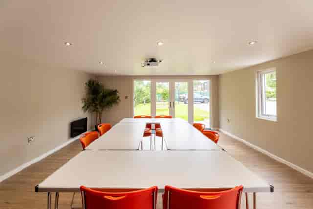 U-shaped meeting room in Moseley Community Hub for strategy sessions and off-site team workshops.