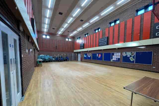 Main Hall in Kings Heath Secondary School with open-plan space for exhibitions and community events.