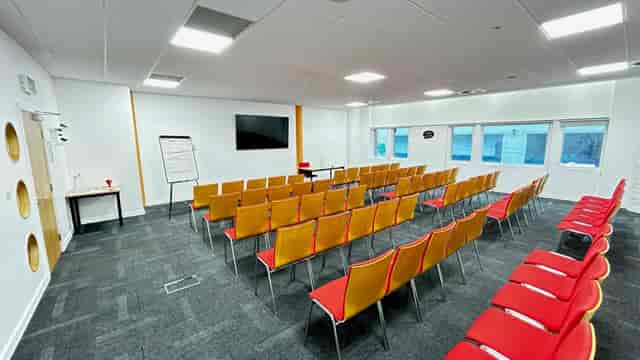 G18 Classroom theater-style seating for school meeting or educational event.