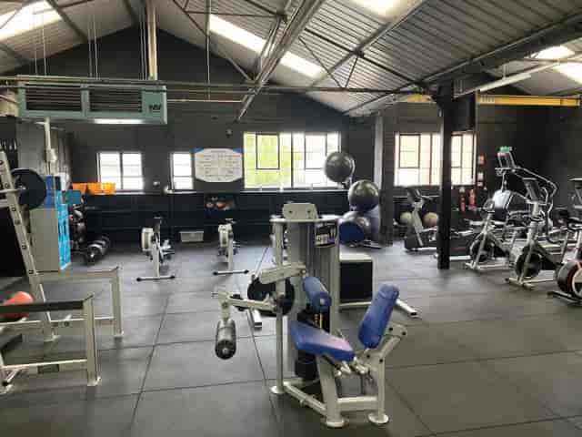 Industrial gymnasium for off-site events and team-building workshops with natural light.