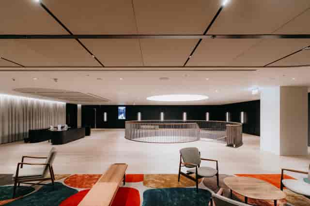 Modern atrium event space with circular architecture for luxury networking and VIP check-ins.