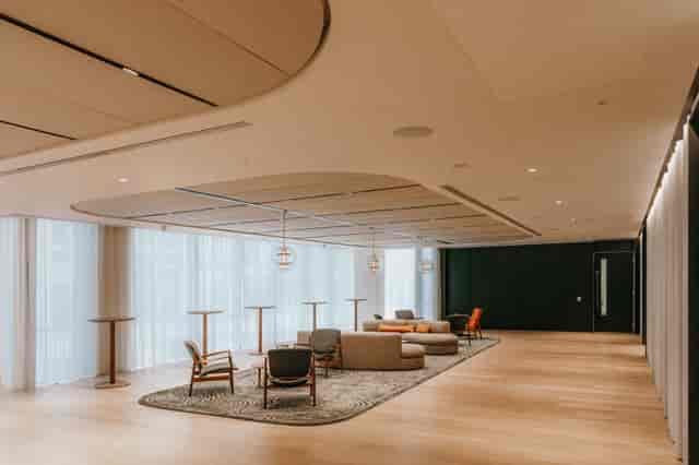Modern event space at The Forum with networking clusters for corporate conferences and workshops.