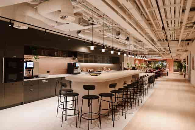 Industrial-chic breakout space at The Forum for networking and collaborative workshops.