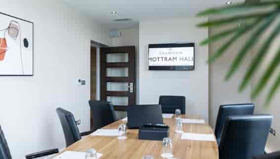 Private office suite in Eastham Hall featuring a professional boardroom setup for corporate meetings.