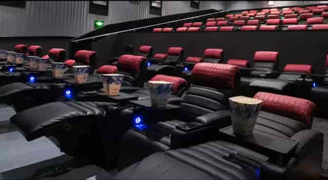 Luxury cinema venue for corporate presentations and private screenings with plush recliners.