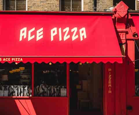 Marzano Lounge at ACE Pizza: Branded exterior for team-building offsites and social events.