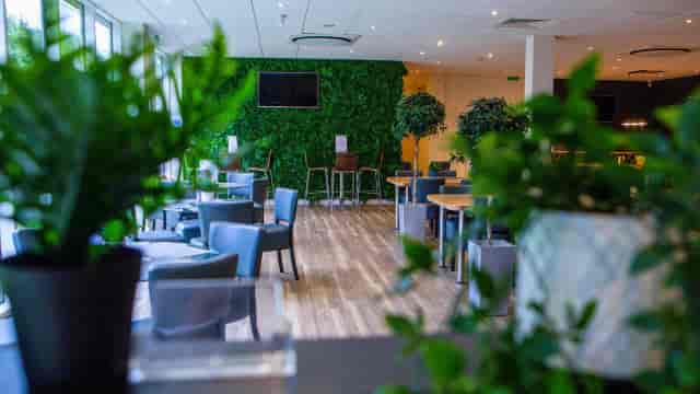 Biophilic function room at Sherwoods with green wall for networking and corporate events.