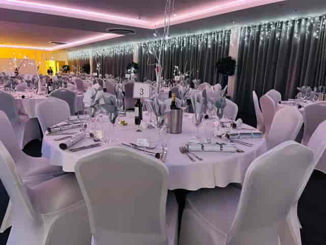 Banquet setup in V Rum Brooks Suite with festive icicle lighting for a holiday gala dinner.
