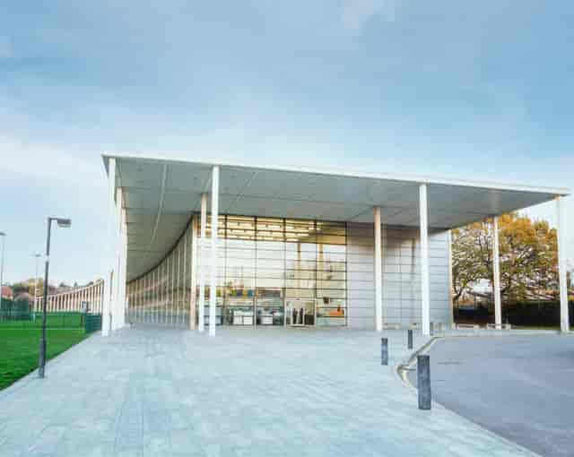 Modern sports hall at Willesden Sports Centre with branding space for corporate events and exhibitions.