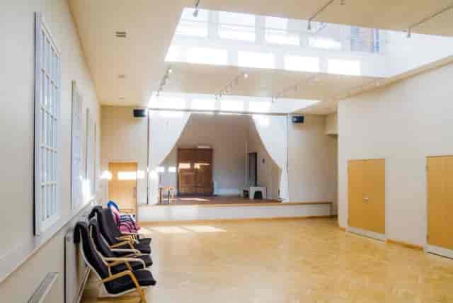 St Mark’s Kensal Rise hall with stage, ideal for community events and theatrical performances.