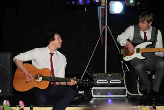 Duo performing live on Main Theatre stage at Chequer Mead, ideal for corporate event entertainment.