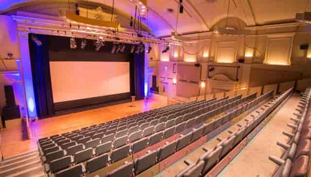 Main Auditorium at The Berry Theatre with professional lighting for conferences and presentations.